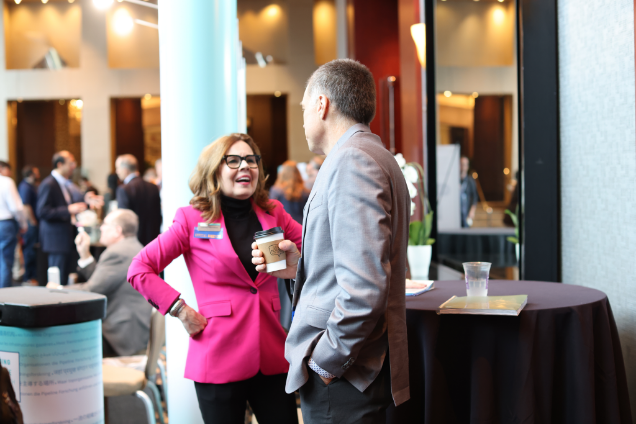Two industry leaders talking at conference